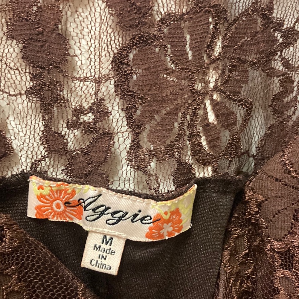 what ; brown ( on the top ) see thru design with flowers with zipper. its cute💫